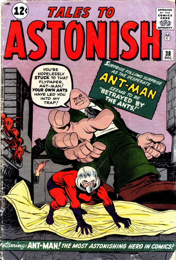 Cover of Tales to Astonish #38 showing Ant-Man stuck to flypaper before a giant villain, comic cover