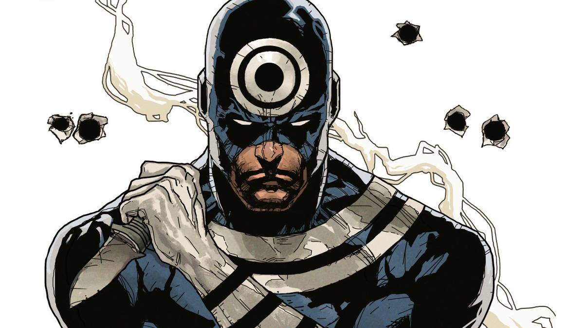 Bullseye close-up in his costume with the target emblem on his forehead, holding a knife