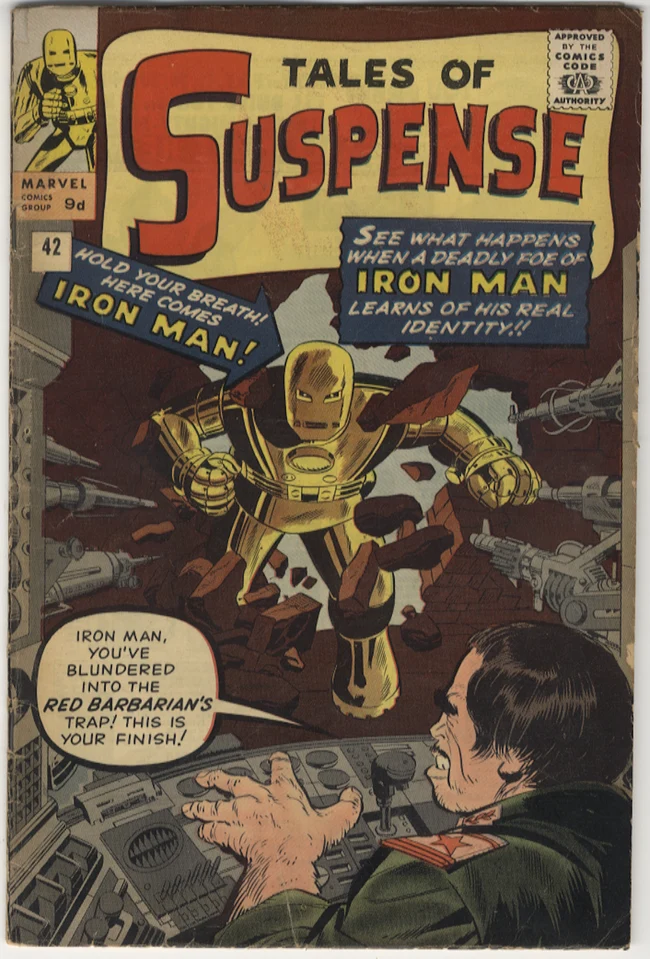 The gold Iron Man bursting through a wall on the Tales of Suspense #42 cover