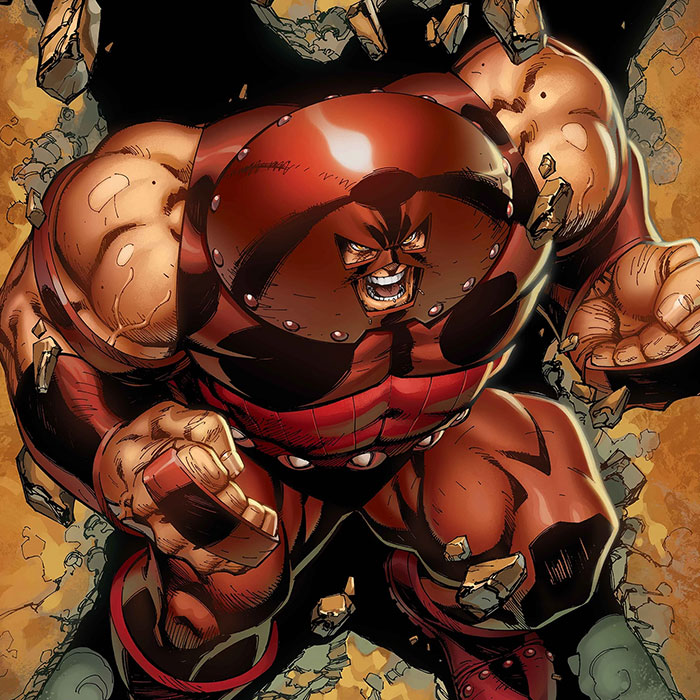 The Juggernaut in his red domed helmet charging forward through shattered rock