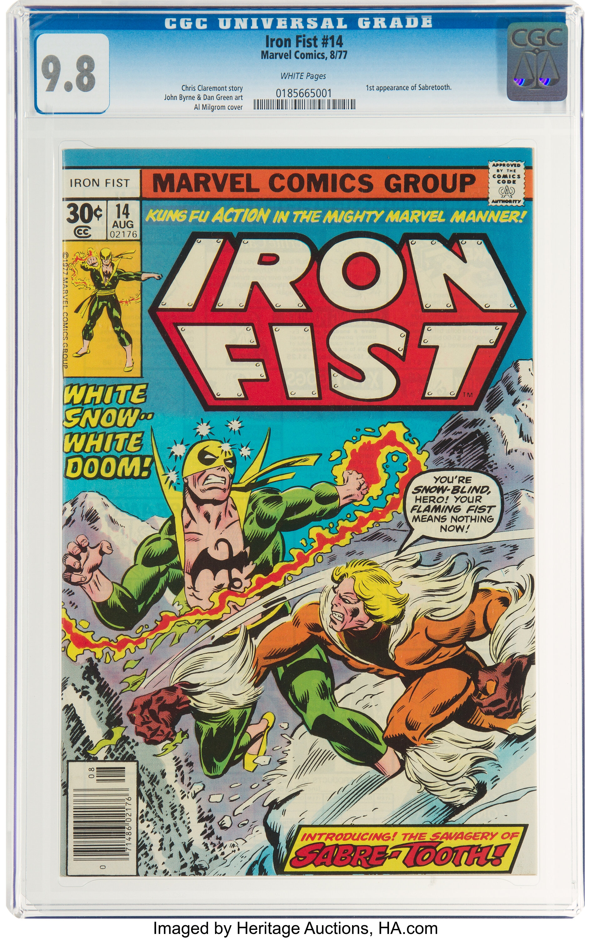 Graded copy of Iron Fist #14 (1977), slab labeled '1st appearance of Sabretooth'; cover shows Iron Fist fighting Sabretooth in the snow, banner 'INTRODUCING! THE SAVAGERY OF SABRE-TOOTH!'