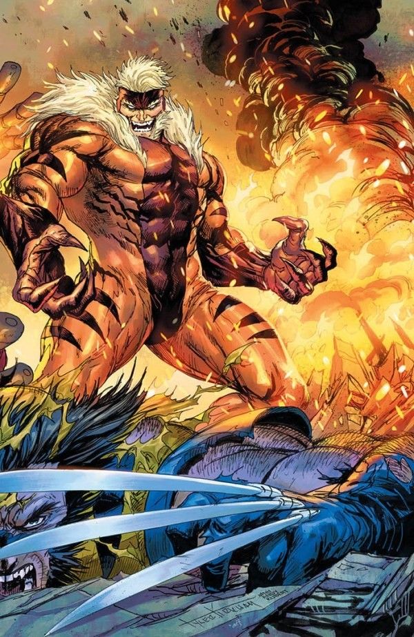 Sabretooth looming over Wolverine with adamantium claws in foreground