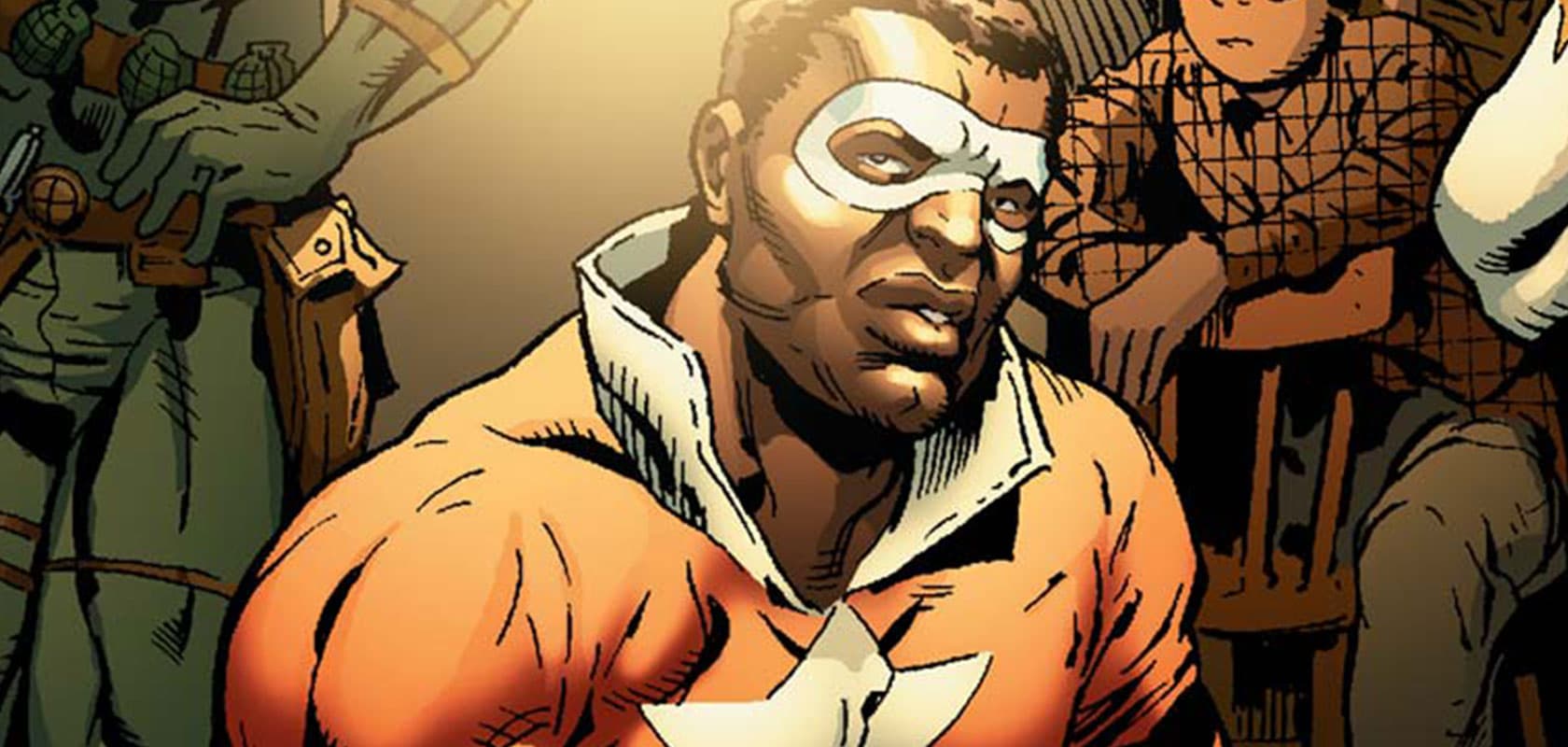 Lemar Hoskins as Battlestar in an orange costume with a white mask and star
