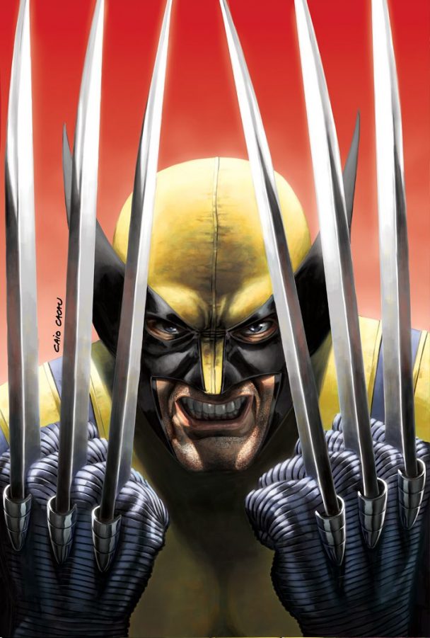 Wolverine in yellow mask holding six long claws toward the viewer